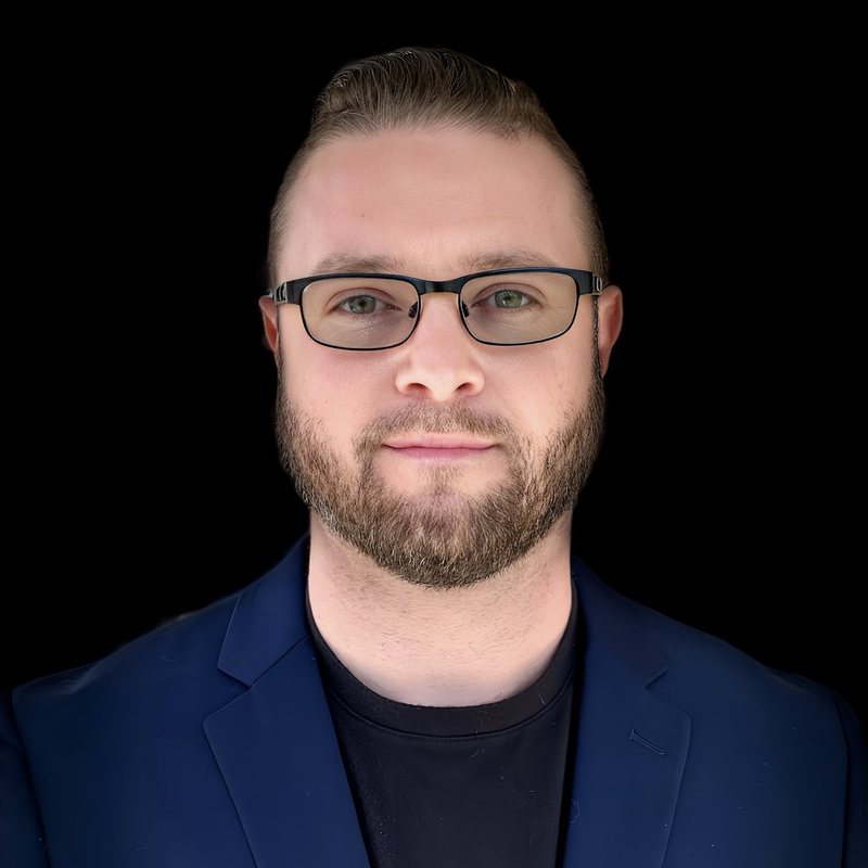 Dylan Priest, founder of 1UP Financial, in a navy blazer
